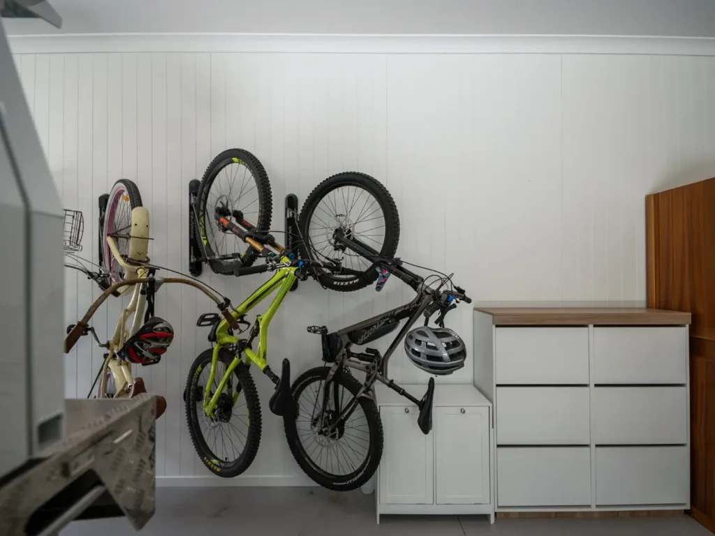 Modern garage interior featuring bicycles and storage cabinets