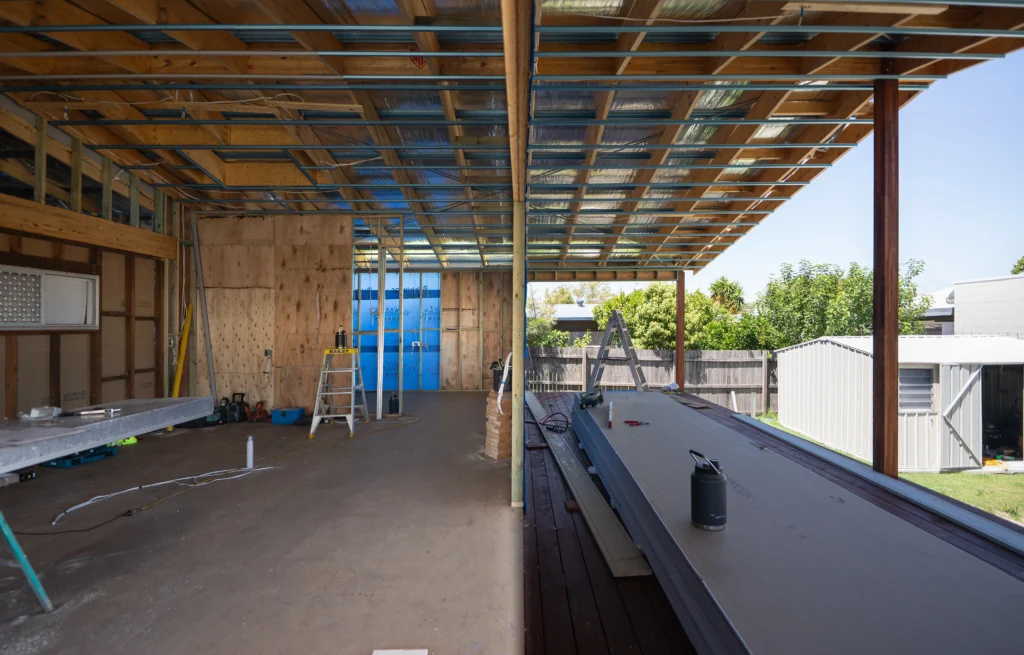 Interior frame and roof structure during a home extension build at Golden Beach, Sunshine Coast by Bozcon Construct