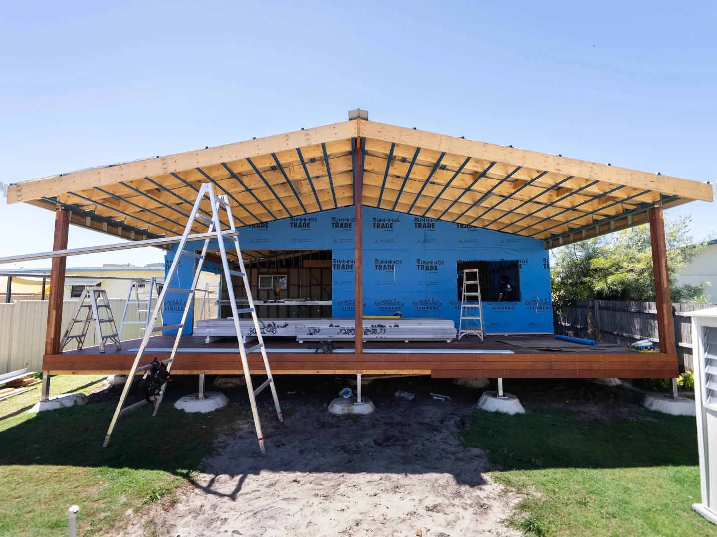 Timber roof frame and deck structure under construction during a home extension at Golden Beach, Sunshine Coast by Bozcon Construct