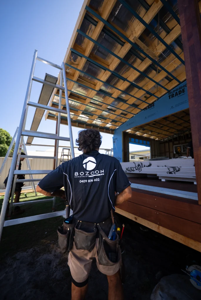 Bozcon Construct builder working on timber roof framing during a home extension at Golden Beach, Sunshine Coast